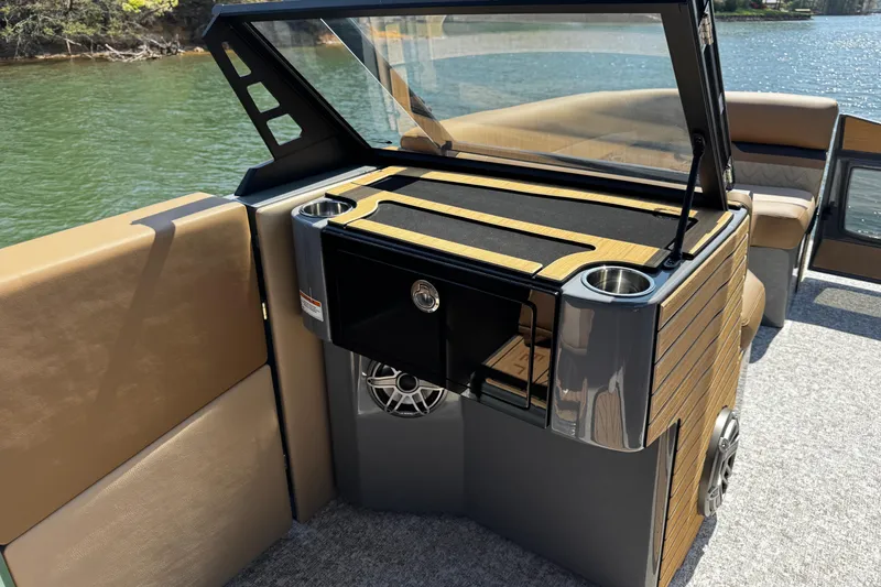 Slide: The Image of 2026 Revel RS25L boat interior with sleek wood finish and modern amenities. - 11