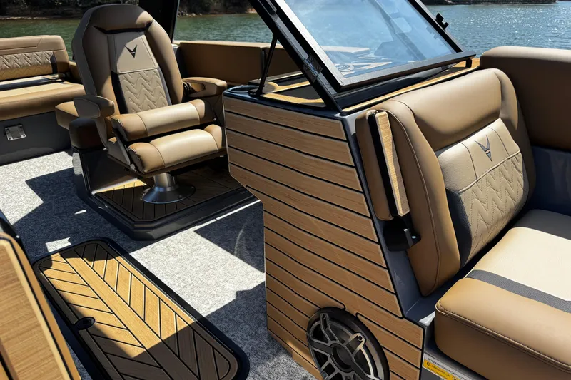 Slide: The Image of Luxurious interior of 2026 Revel RS25L boat with elegant seating and wood accents. - 16
