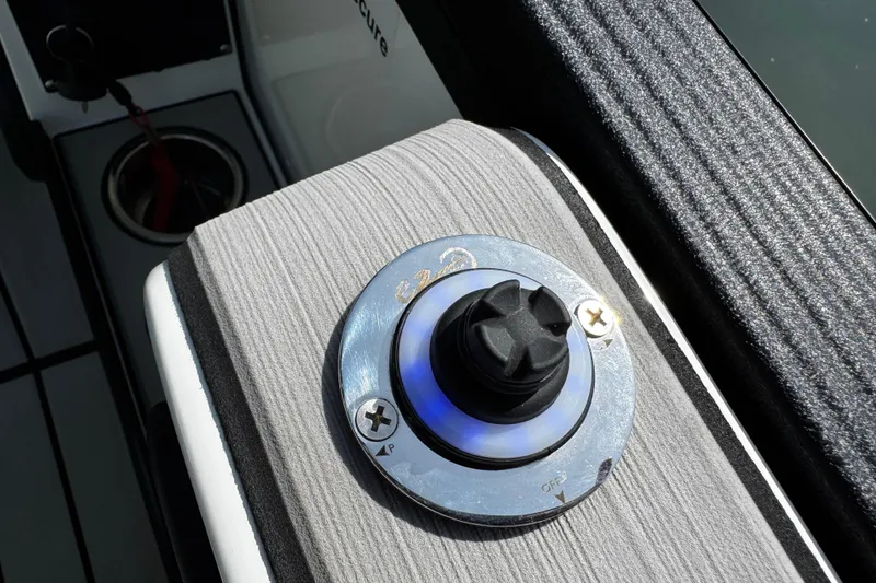Slide: The Image of Control knob on 2021 Montara 25 boat, featuring sleek design and blue LED lighting. - 15