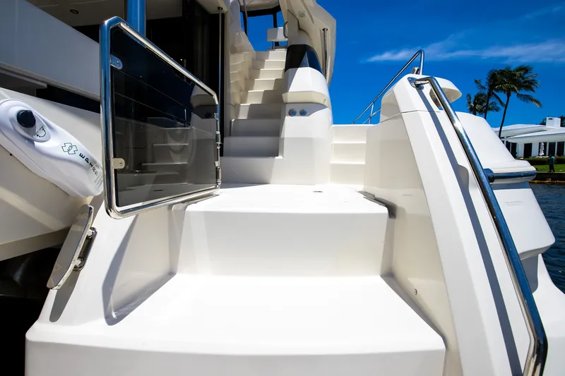Slide: The Image of Aquila 44 Yacht 2017, stairs to deck, sunny day. - 25