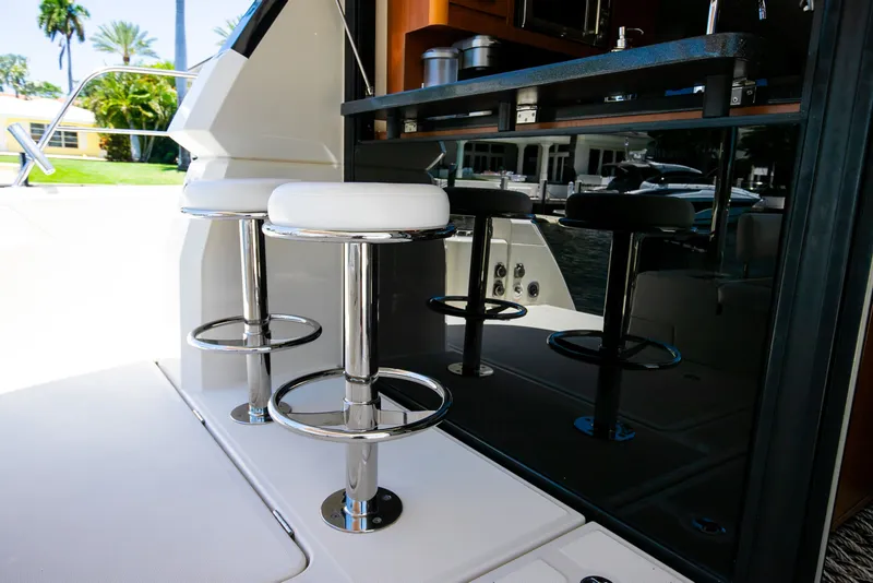 Slide: The Image of Interior of 2017 Aquila 44 Yacht with bar stools. - 39