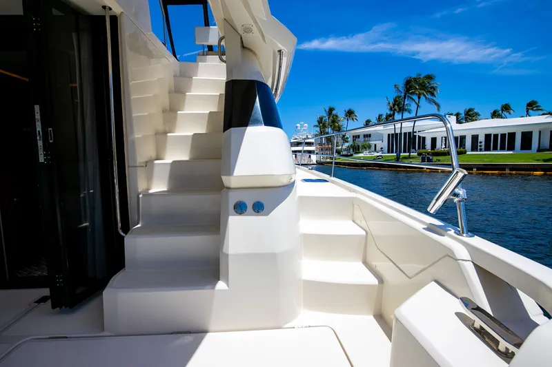 Slide: The Image of Aquila 44 Yacht 2017 with stairs and waterfront view. - 41