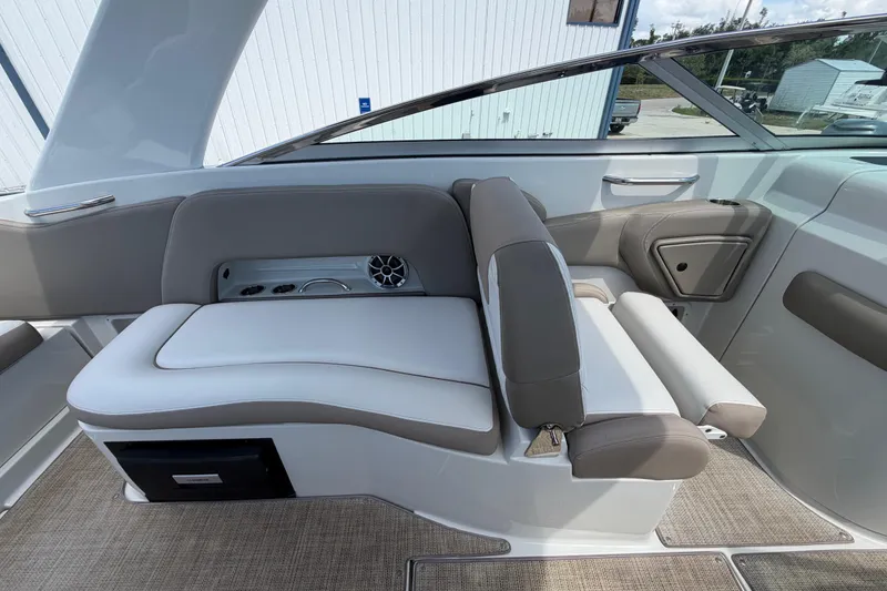 Slide: The Image of 2019 Crownline Eclipse E295 XS boat interior with beige seating and modern design. - 16