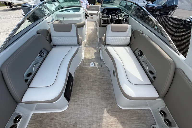 Slide: The Image of 2019 Crownline Eclipse E295 XS boat interior with luxurious seating and modern dashboard. - 19