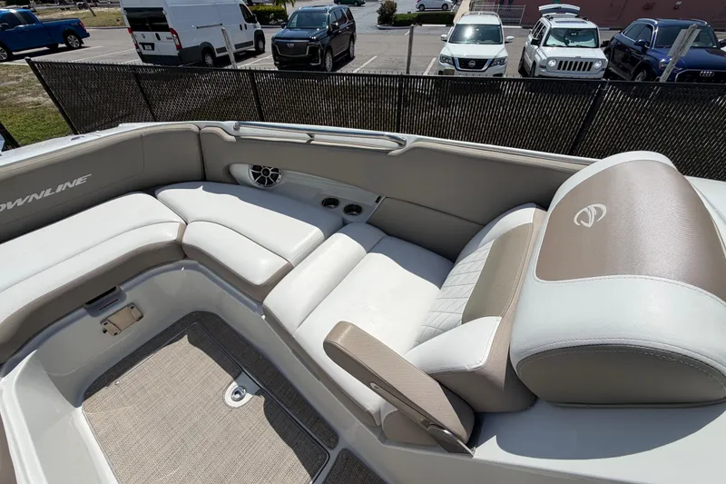 Slide: The Image of 2019 Crownline Eclipse E295 XS boat interior with beige and white seating. - 31