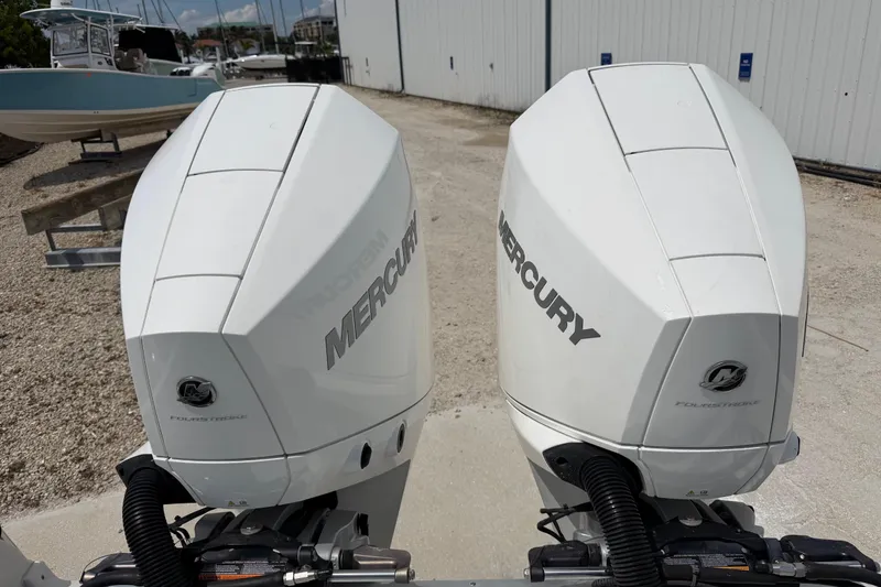 Slide: The Image of Twin Mercury outboard engines on a 2019 Crownline Eclipse E295 XS boat. - 7