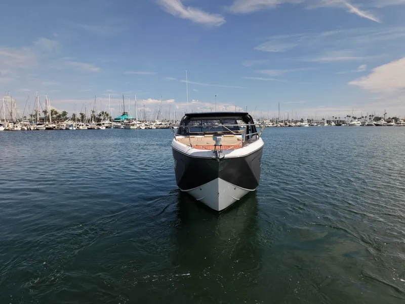 Slide: The Image of The 2024 Hanover 387 cruising on calm waters in a harbor. - 10