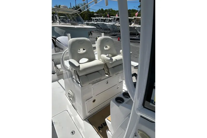 Slide: The Image of 2018 Sportsman Open 282 Center Console boat interior with dual white seats. - 3
