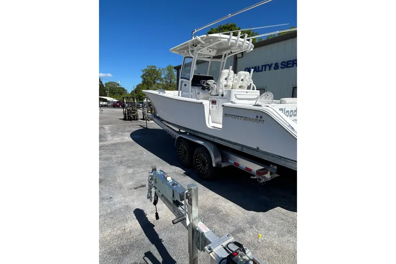 Slide: The Image of 2018 Sportsman Open 282 Center Console boat on trailer, parked outdoors. - 7