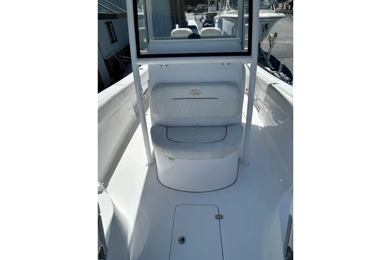 Slide: The Image of 2018 Sportsman Open 282 Center Console boat interior with cushioned seating. - 8