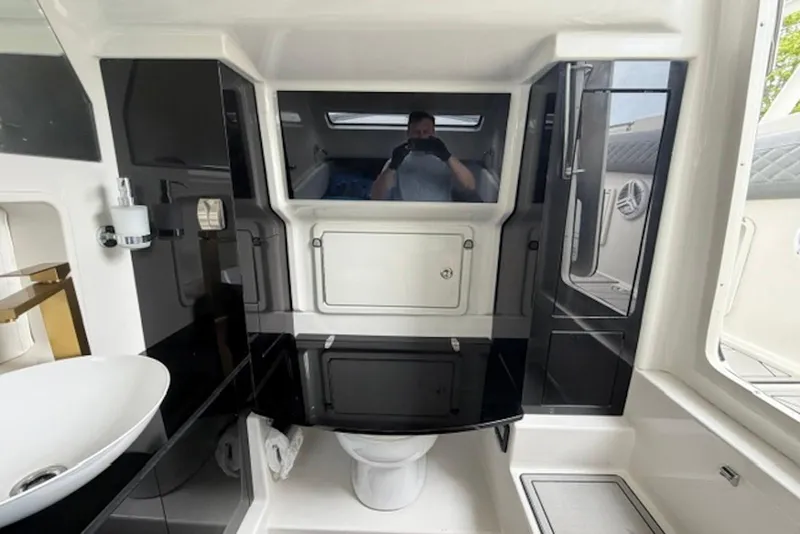 Slide: The Image of Luxurious bathroom interior of 2016 Chris-Craft Catalina 34 boat, featuring modern fixtures and sleek design. - 5
