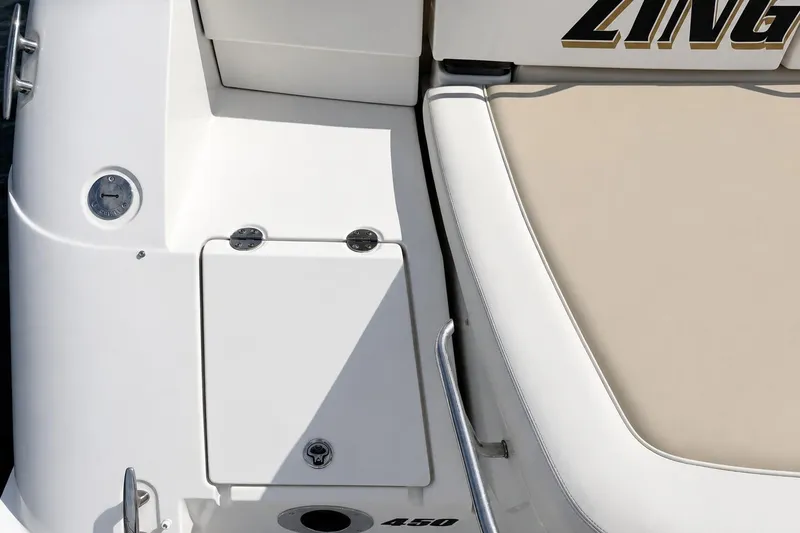 Slide: The Image of 2013 Sea Ray 450 Sundancer boat deck with seating and storage compartment. - 10
