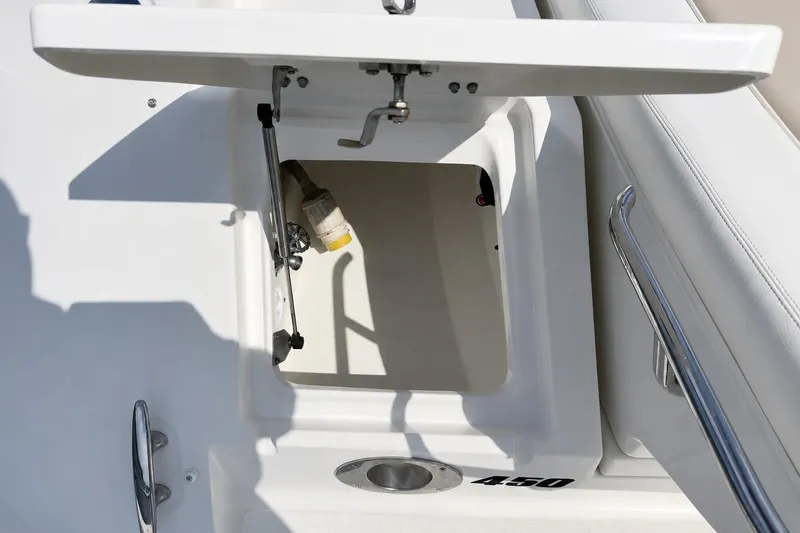Slide: The Image of Open storage compartment on a 2013 Sea Ray 450 Sundancer boat deck. - 11