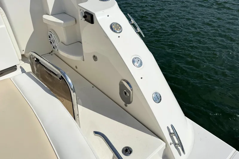 Slide: The Image of 2013 Sea Ray 450 Sundancer boat deck with water view and control panel. - 12