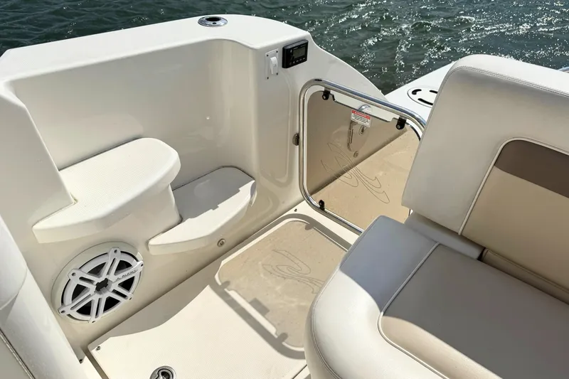 Slide: The Image of Interior view of 2013 Sea Ray 450 Sundancer boat, featuring seating and speaker system. - 13