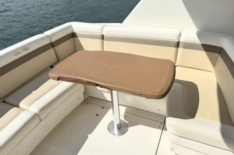 Slide: The Image of Luxurious seating area on a 2013 Sea Ray 450 Sundancer yacht with a stylish table. - 15