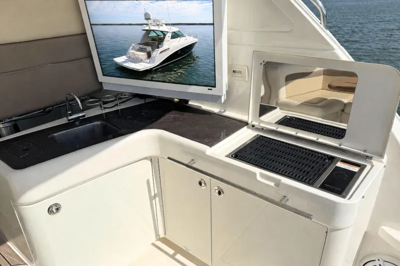 Slide: The Image of Luxury yacht kitchen area on 2013 Sea Ray 450 Sundancer with grill and sink. - 19
