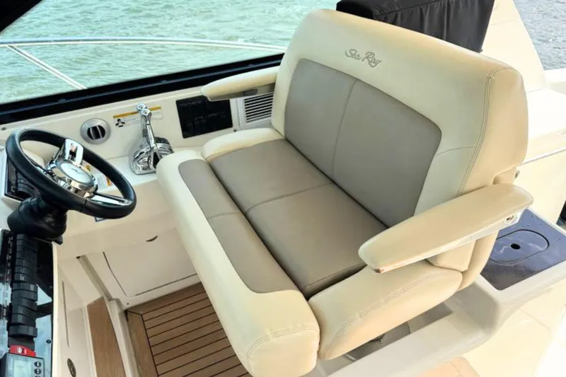 Slide: The Image of Captain's seat and helm of 2013 Sea Ray 450 Sundancer yacht. - 24
