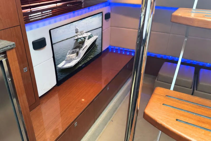Slide: The Image of Interior of 2013 Sea Ray 450 Sundancer yacht with modern design and wooden finishes. - 30