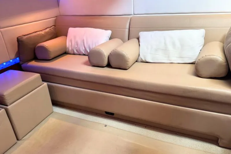 Slide: The Image of Luxurious beige seating area inside a 2013 Sea Ray 450 Sundancer yacht. - 32