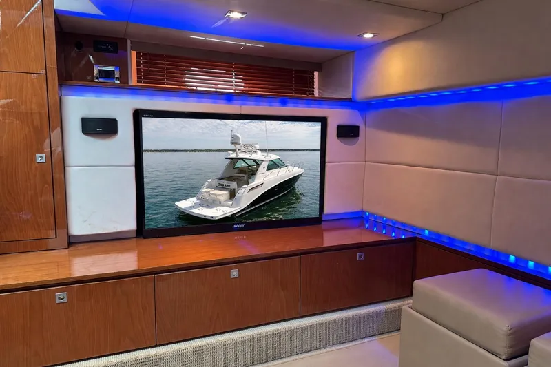 Slide: The Image of Luxurious interior of a 2013 Sea Ray 450 Sundancer yacht with a large TV display. - 33
