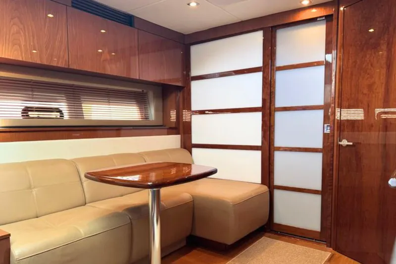 Slide: The Image of Luxurious interior of 2013 Sea Ray 450 Sundancer yacht with leather seating and wooden finishes. - 34
