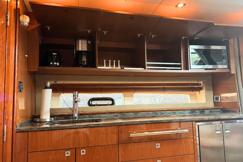 Slide: The Image of Luxurious galley kitchen in 2013 Sea Ray 450 Sundancer yacht with modern appliances. - 37