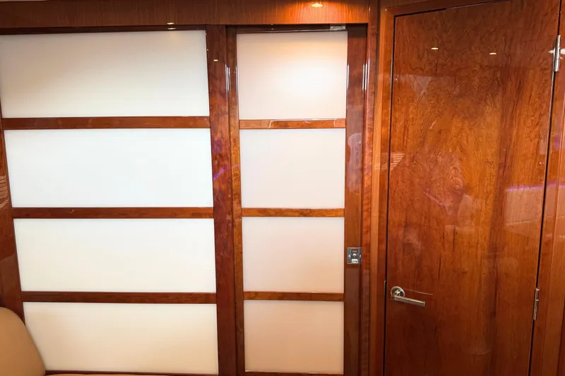 Slide: The Image of Interior of 2013 Sea Ray 450 Sundancer yacht with wooden paneling and modern design. - 44