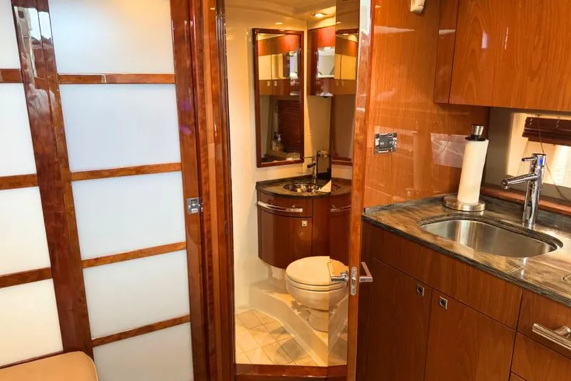 Slide: The Image of Luxurious interior of 2013 Sea Ray 450 Sundancer yacht featuring bathroom and kitchenette. - 45