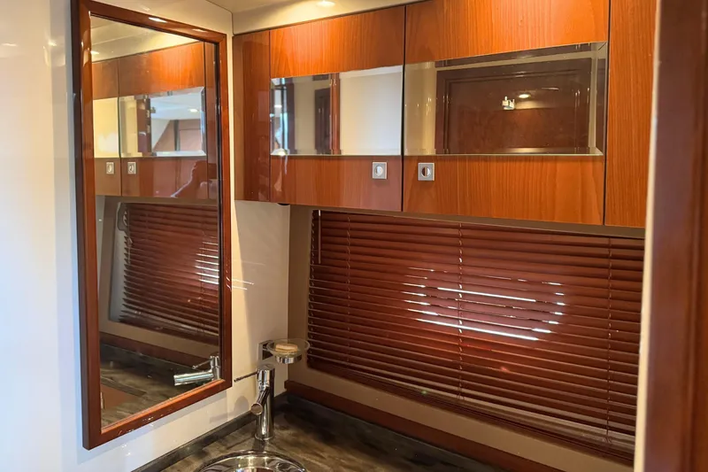 Slide: The Image of Luxurious interior of 2013 Sea Ray 450 Sundancer yacht bathroom with wood accents and modern fixtures. - 47
