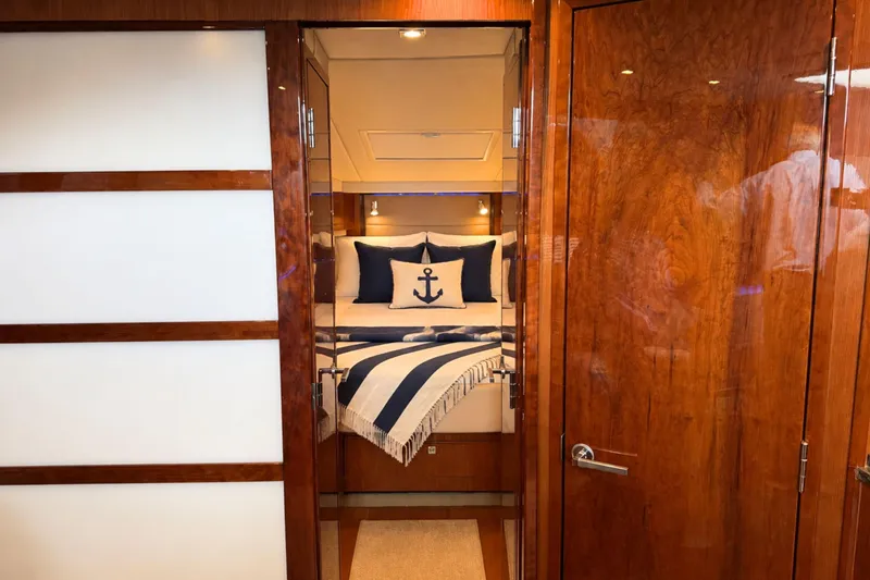 Slide: The Image of Luxurious cabin interior of 2013 Sea Ray 450 Sundancer yacht with nautical-themed decor. - 49