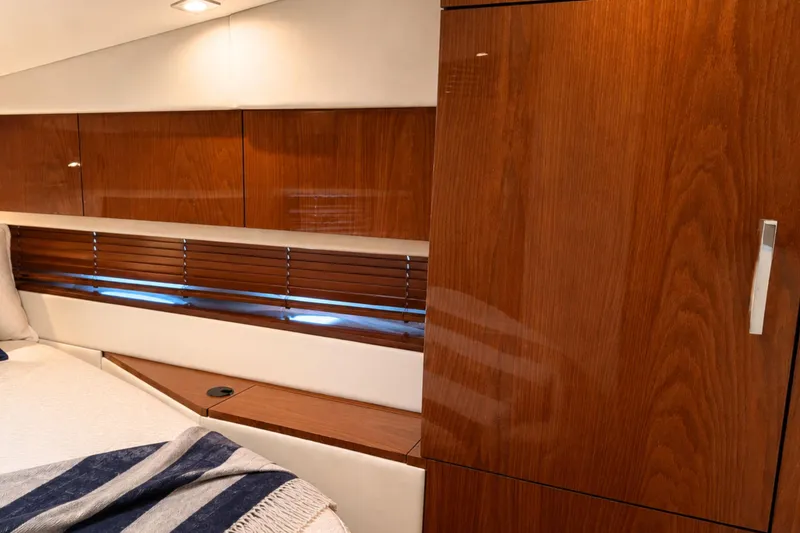 Slide: The Image of Luxurious interior of 2013 Sea Ray 450 Sundancer yacht with elegant wood finishes. - 54