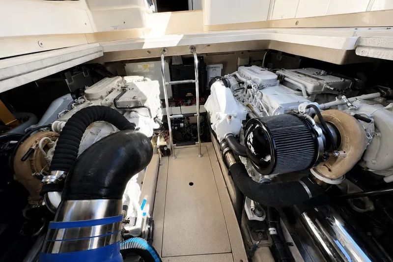 Slide: The Image of Engine room of a 2013 Sea Ray 450 Sundancer yacht, showcasing dual engines. - 62
