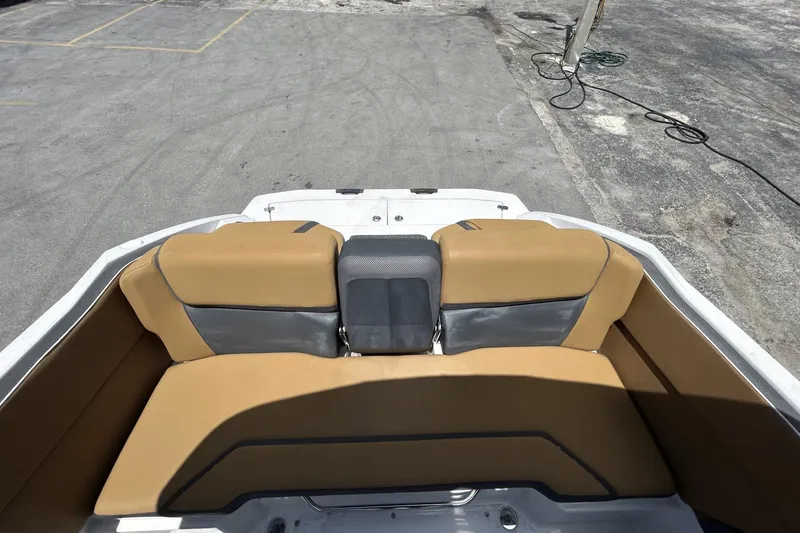 Slide: The Image of 2019 Scarab 255 ID boat interior with tan and gray seating. - 12
