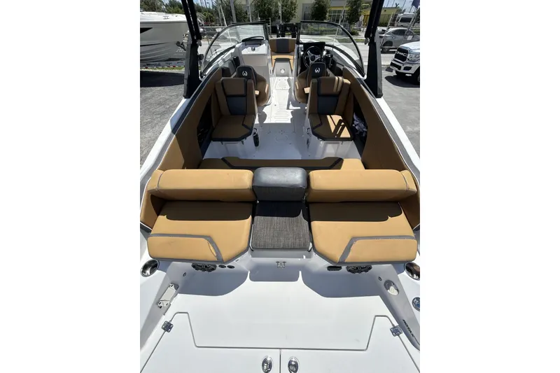 Slide: The Image of 2019 Scarab 255 ID boat interior with tan seating and modern design. - 13