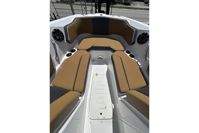 Slide: The Image of 2019 Scarab 255 ID boat interior with tan seating and cup holders. - 15