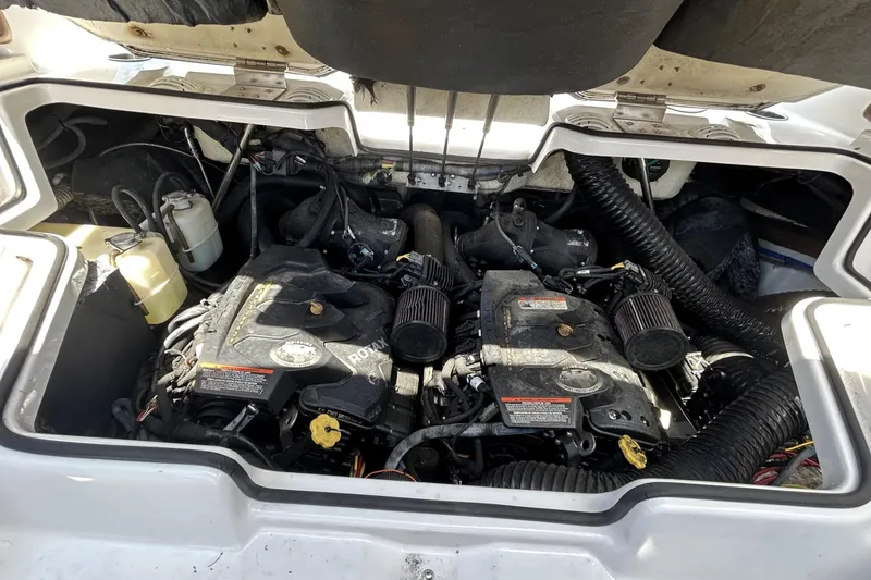 Slide: The Image of Engine compartment of a 2019 Scarab 255 ID boat, featuring dual Rotax engines. - 16