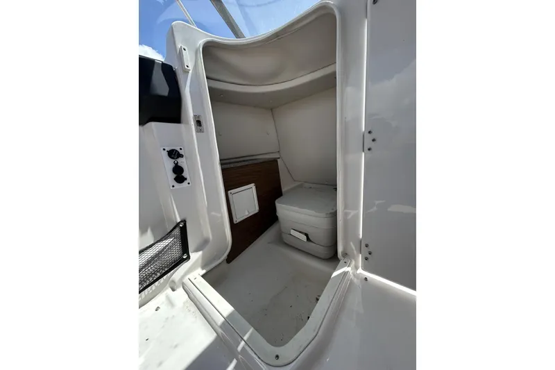 Slide: The Image of Interior of 2019 Scarab 255 ID boat showing compact cabin space. - 21