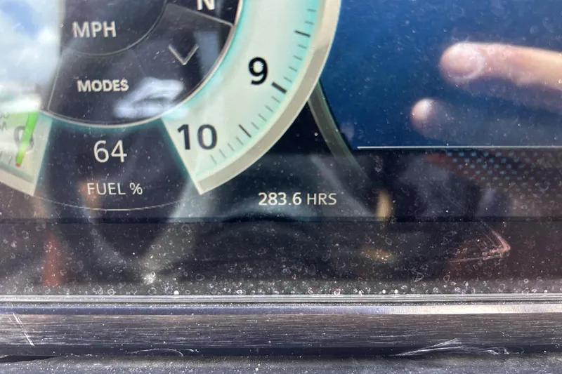Slide: The Image of Dashboard of 2019 Scarab 255 ID showing 64% fuel and 283.6 hours usage. - 24