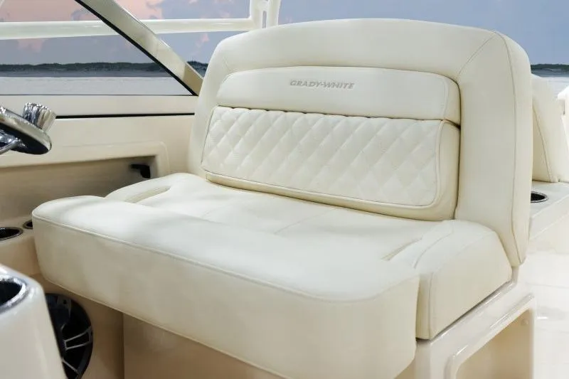 Slide: The Image of Luxurious seating on 2027 Grady-White Freedom 307 boat, featuring elegant cream upholstery. - 10