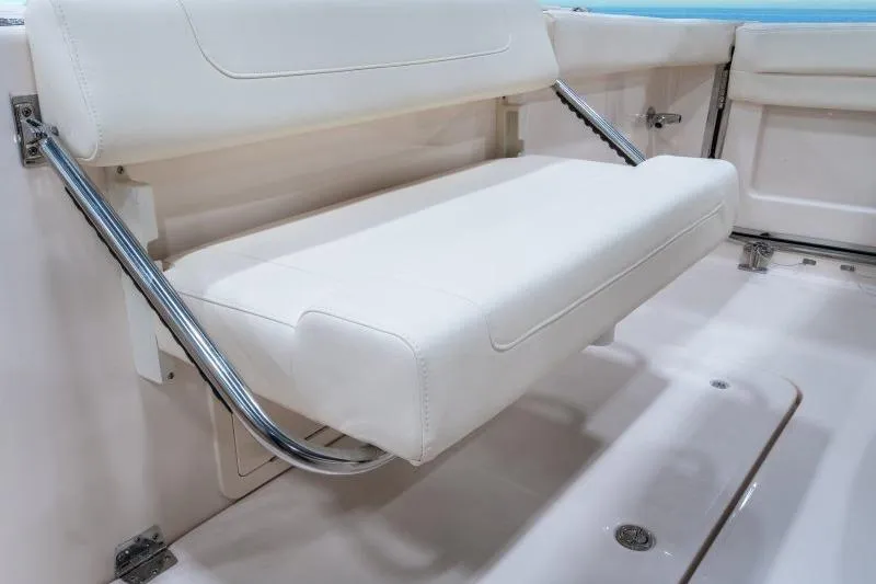 Slide: The Image of 2027 Grady-White Freedom 307 boat with white cushioned seating and stainless steel supports. - 4