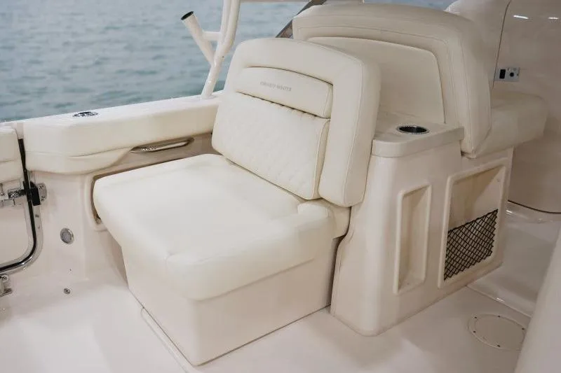 Slide: The Image of Luxurious seating on 2027 Grady-White Freedom 307 boat, featuring elegant cream upholstery. - 9
