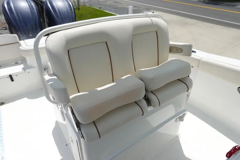 Slide: The Image of 2022 Sea Hunt Gamefish 27 Coffin Box boat with dual cushioned seats and twin engines. - 15
