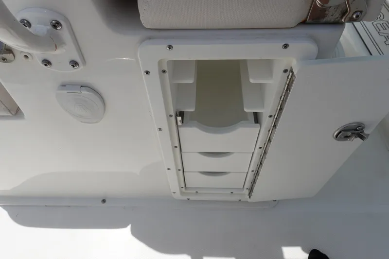Slide: The Image of 2022 Sea Hunt Gamefish 27 Coffin Box storage compartment with open drawers. - 17