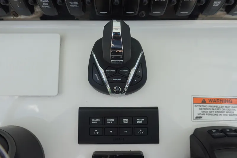 Slide: The Image of Control panel of 2022 Sea Hunt Gamefish 27 Coffin Box boat with joystick and warning label. - 20