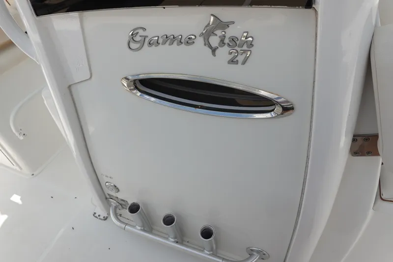 Slide: The Image of 2022 Sea Hunt Gamefish 27 Coffin Box, sleek white design with chrome accents. - 23