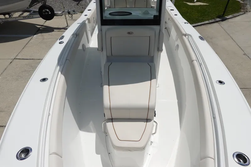 Slide: The Image of 2022 Sea Hunt Gamefish 27 Coffin Box boat interior, featuring spacious seating and sleek design. - 26
