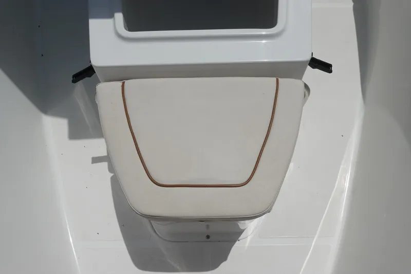 Slide: The Image of 2022 Sea Hunt Gamefish 27 Coffin Box with cushioned seat, white and brown trim. - 28