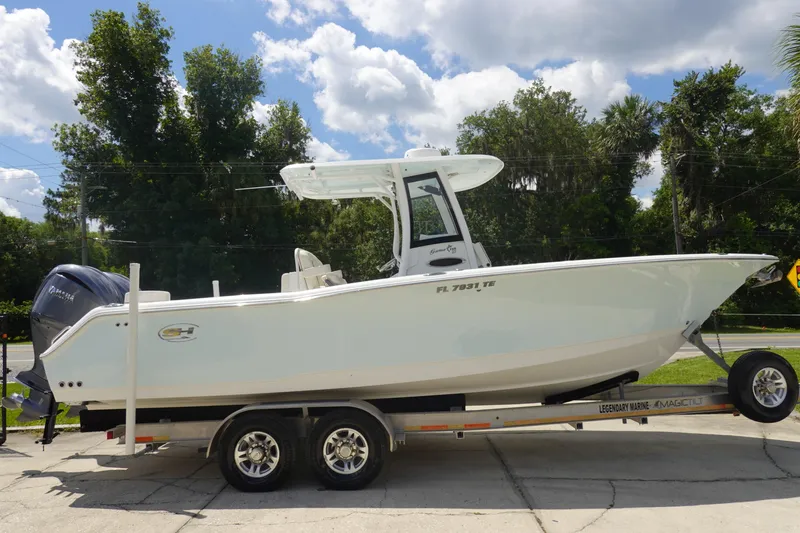 Slide: The Image of 2022 Sea Hunt Gamefish 27 Coffin Box boat on trailer, parked outdoors. - 3