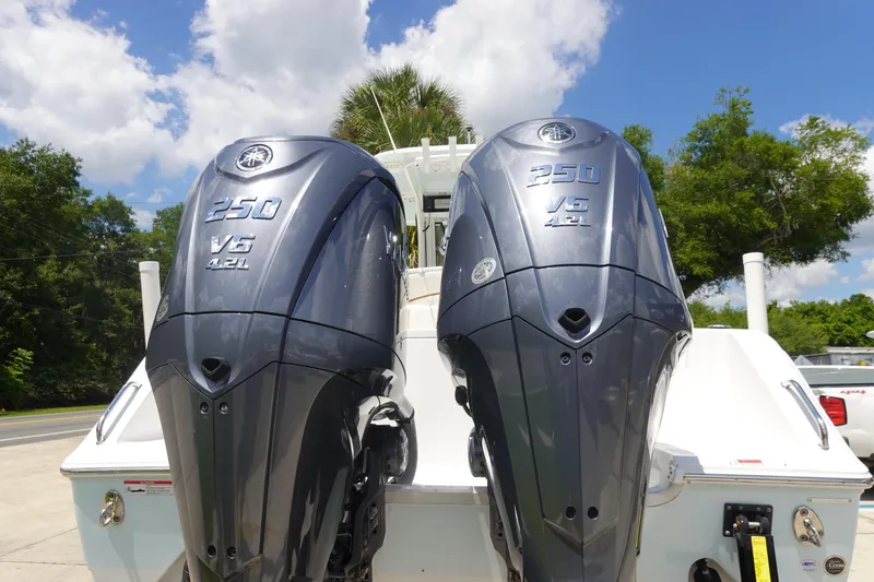 Slide: The Image of Twin Yamaha 250 V6 outboard engines on a 2022 Sea Hunt Gamefish 27 Coffin Box boat. - 4